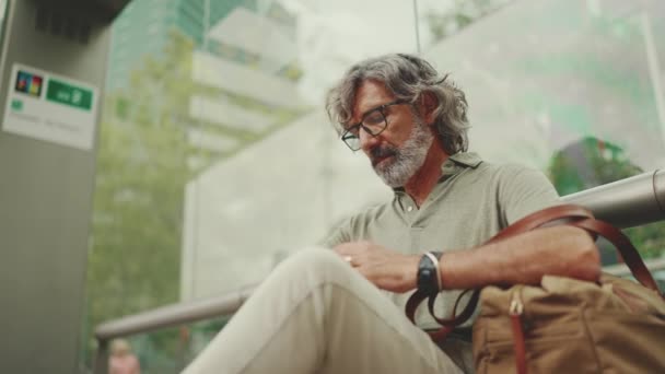 Thoughtful Middle Aged Man Gray Hair Beard Looks His Watch — Video