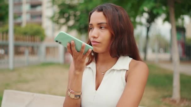 Beautiful Girl Long Dark Hair Wearing White Top Sits Bench — Vídeo de stock