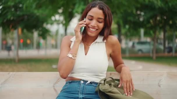 Beautiful Girl Long Dark Hair Wearing White Top Sits Bench — Vídeos de Stock