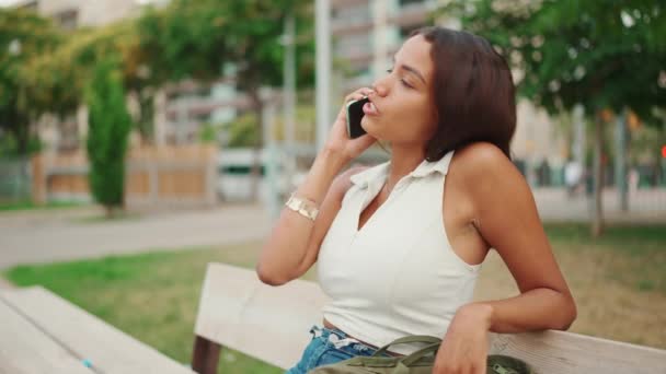 Beautiful Girl Long Dark Hair Wearing White Top Sits Bench — Vídeo de stock