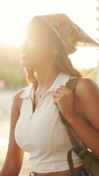 Vertical Video Cute Tanned Woman Wearing White Top Yellow Bandana — Vídeos de Stock