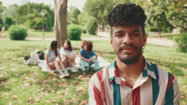 Close Young Smiling Man Curly Hair Wearing Striped Shirt Posing — Stockvideo