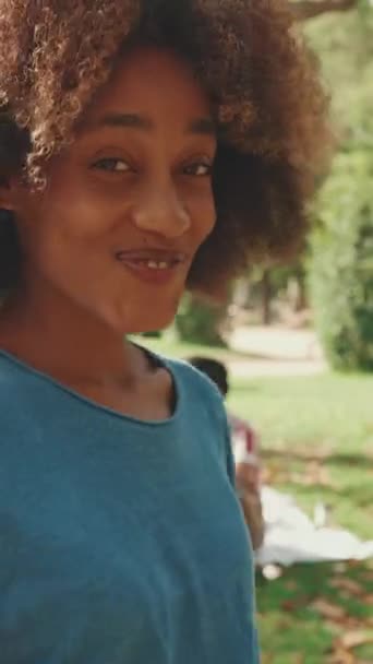 Vertical Video Close Young Smiling Woman Curly Hair Wearing Blue — Vídeo de Stock