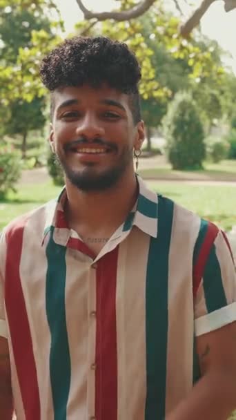 Vertical Video Close Young Smiling Man Curly Hair Wearing Striped — Video Stock