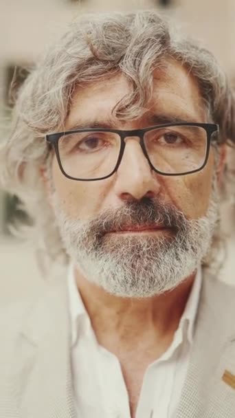Vertical Video Close Mature Businessman Beard Eyeglasses Wearing Gray Jacket — Stockvideo