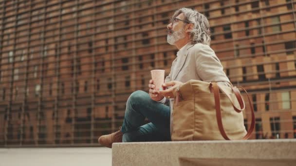 Profile Mature Businessman Beard Eyeglasses Wearing Gray Jacket Holding Takeaway — Stock Video