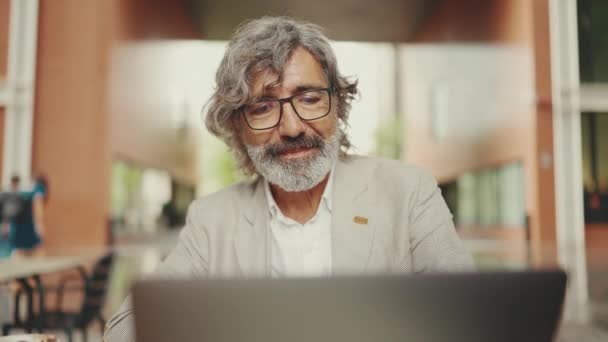 Mature Businessman Beard Eyeglasses Wearing Gray Jacket Sits Cafe Middle — 图库视频影像