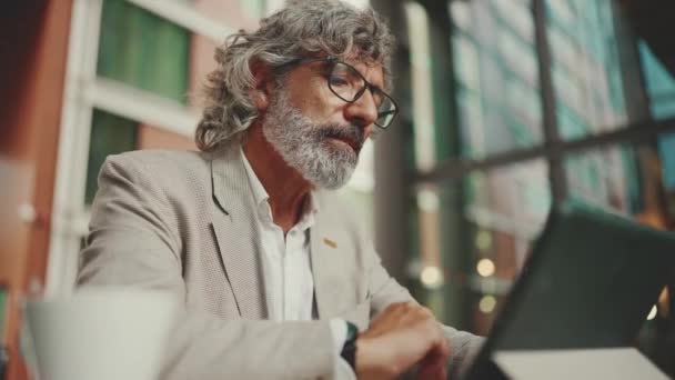 Mature Businessman Beard Eyeglasses Wearing Gray Jacket Working Tablet Sitting — Video Stock