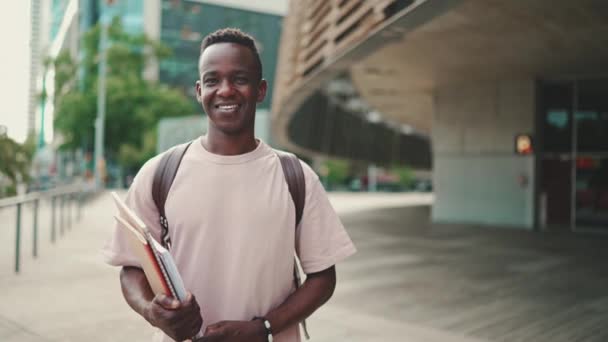 Young African Student Stands University Looks Camera Smiles — Vídeos de Stock