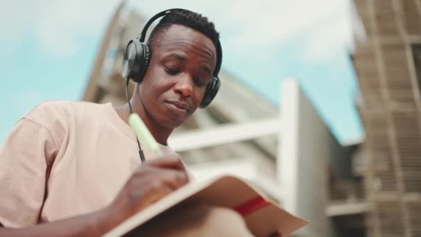 Young African Student Sitting University Taking Notes While Study Online — Vídeos de Stock