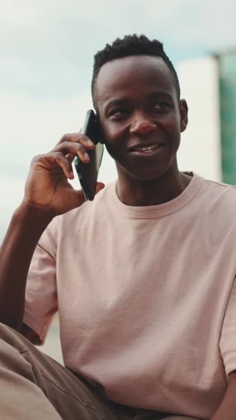 Vertical Video Smiling Young African Student Sitting University Talking Cellphone — Stock Video