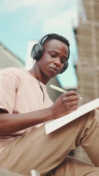 Vertical Video Young African Student Sitting University Taking Notes While — 图库视频影像