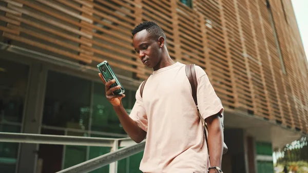 Young African Student Walks Stairs University Using Cellphone — Stockfoto