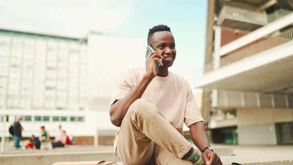 Smiling Young African Student Sitting University Talking Cellphone — Stock Fotó