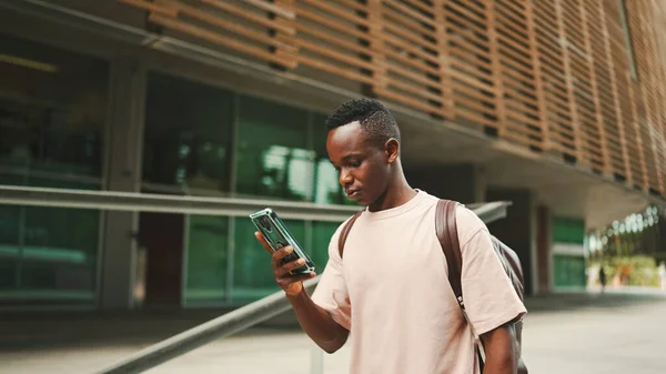 Young African Student Walks Stairs University Using Cellphone — Stockfoto