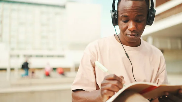 Young African Student Sitting University Taking Notes While Study Online — Stock Fotó