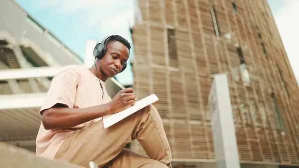 Young African Student Sitting University Taking Notes While Study Online — Stock Fotó
