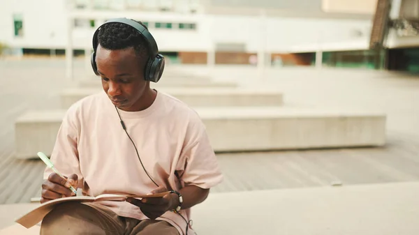 Young African Student Sitting University Taking Notes While Study Online — Stockfoto