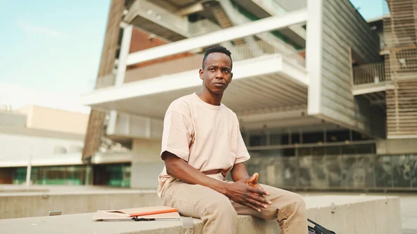 Smiling Young African Student Sitting University Looking — Φωτογραφία Αρχείου