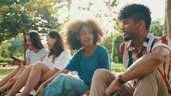 Close Young Man Curly Hair Wearing Striped Shirt Sitting Park — Zdjęcie stockowe