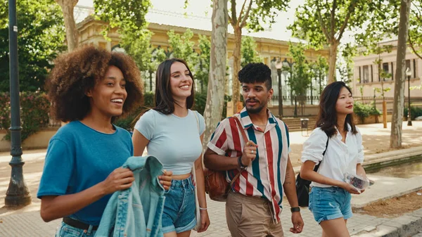 Happy Multiethnic Young People Walk Embracing Summer Day Outdoors Group — Zdjęcie stockowe