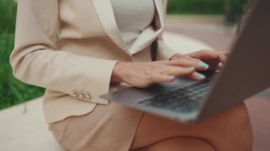Close-up of female hands working on laptop, pc
