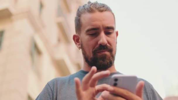 Close Young Man Beard Uses Map Application Mobile Phone — Vídeo de stock