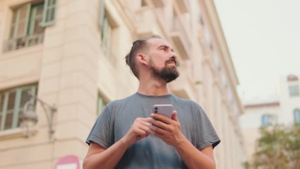 Young Man Beard Uses Map Application Mobile Phone — Wideo stockowe
