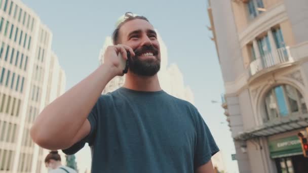 Close Smiling Young Man Beard Talking Phone Modern Buildings Background — Wideo stockowe