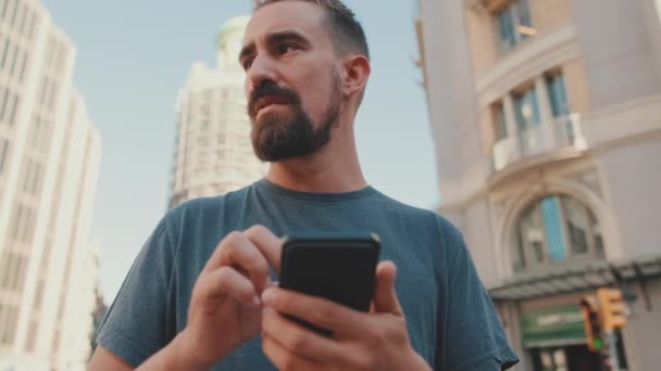 Young Man Beard Uses Map Application Mobile Phone — стоковое видео