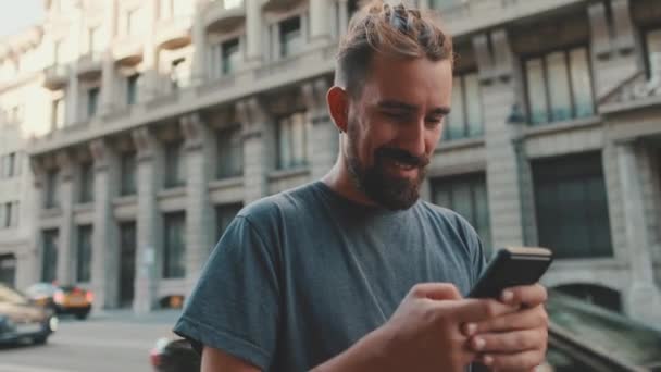 Young Smiling Man Beard Uses Smartphone Road Background — Video