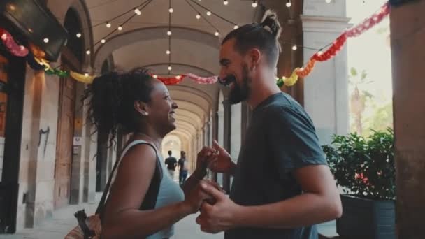 Happy Interracial Couple Dancing Outdoors — стоковое видео