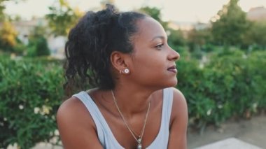 Close-up of young mixed race woman looking away thoughtfully