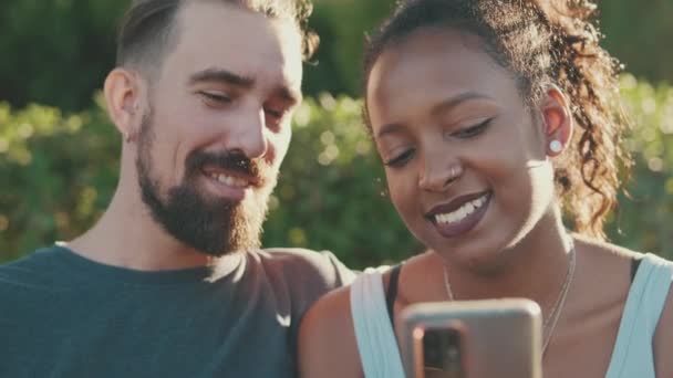 Close Happy Smiling Interracial Couple Watching Video Mobile Phone While — Vídeo de Stock
