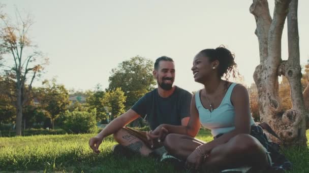 Loving Interracial Couple Holding Hands While Sitting Grass Lawn — Stock videók