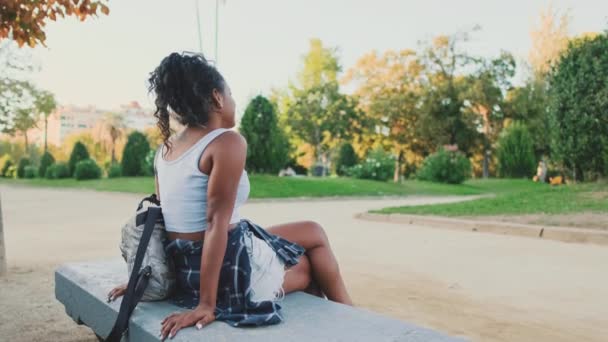 Young Mixed Race Woman Sitting Park Bench — Stockvideo