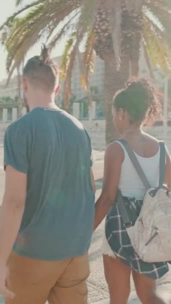 Vertical Video Interracial Couple Walks Street Holding Hands — Stock videók