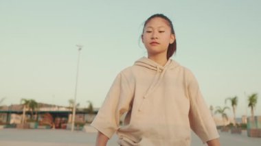 Asian girl in sportswear doing workout, stretching at morning time