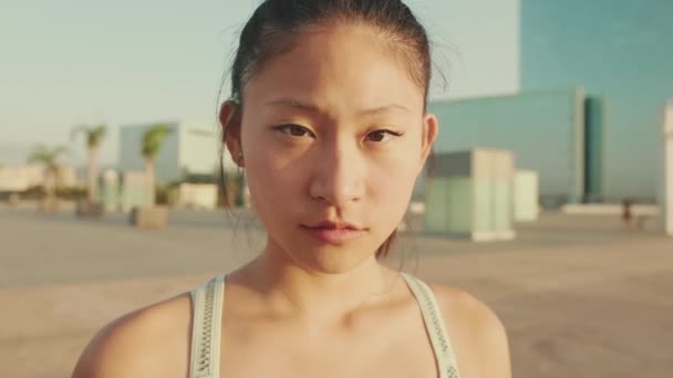 Close Asian Girl Sports Top Looks Camera — Stok video