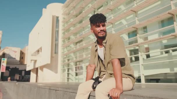 Young Male Student Dressed Olive Colored Shirt Sits Next University — Vídeo de Stock