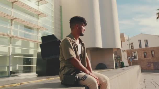 Young Male Student Dressed Olive Colored Shirt Sits Next University — Stock video