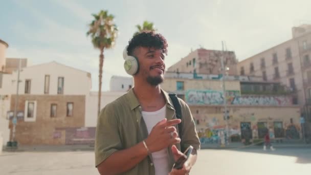 Young Man Beard Olive Colored Shirt Listens Music Headphones Dances — Vídeo de stock