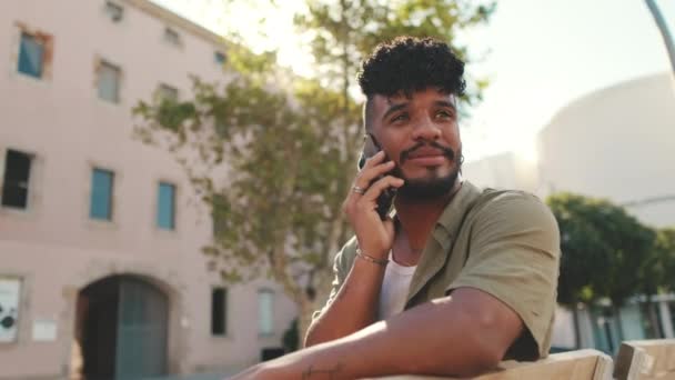 Young Man Beard Wearing Olive Colored Shirt Headphones Talking Phone — Vídeos de Stock
