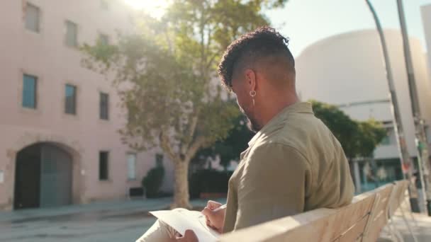 Young Male Student Wearing Olive Colored Shirt Takes Notes Notebook — Stok video