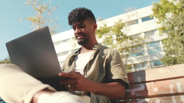 Young Male Student Wearing Olive Colored Shirt Working Laptop While — Stok video