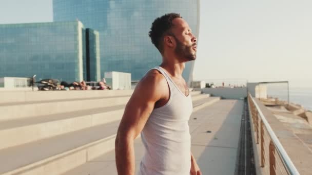 Young Bearded Male Athlete Doing Breathing Exercises Training Embankment — Video Stock