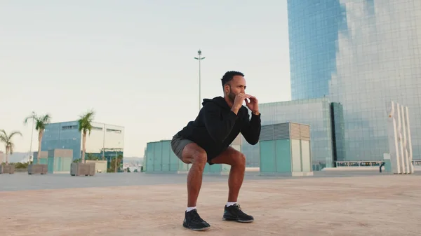 Young Bearded Male Athlete Doing Workout Squats Jumping Waterfront — Φωτογραφία Αρχείου