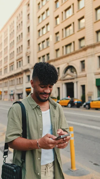 Young Smiling Man Beard Dressed Olive Color Shirt Uses Phone — Stockfoto