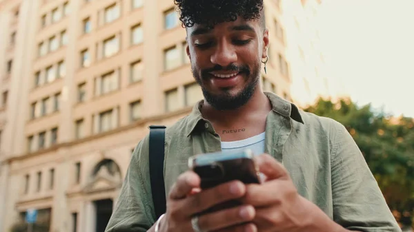 Young Smiling Man Beard Dressed Olive Color Shirt Uses Phone — Stockfoto