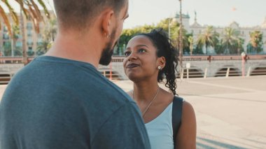 Happy interracial couple looking at each other